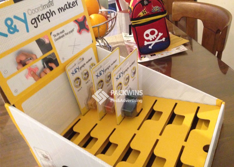 A retail worker easily placing a PDQ tray on a shelf