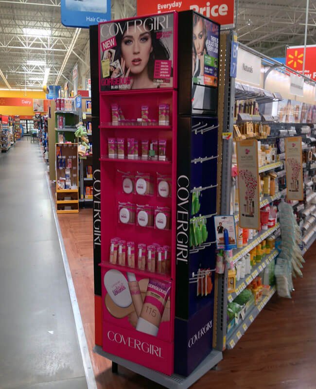Shopper Interacting with Retail Display a happy shopper easily reaching for a product on a display
