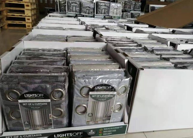 A custom corrugated POP display showcasing hardware products in a retail store.
