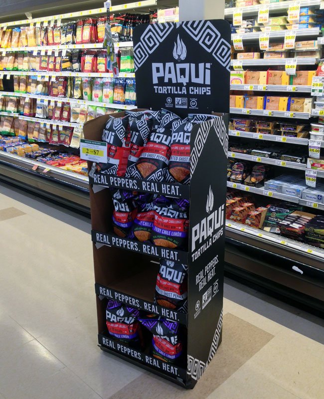 In-Aisle Display Boosting Sales A creative in-aisle display in a supermarket aisle