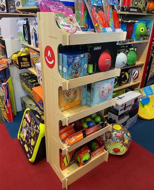 Popularity of corrugated cardboard displays A hero shot of a vibrant, custom-designed corrugated cardboard display in a retail store