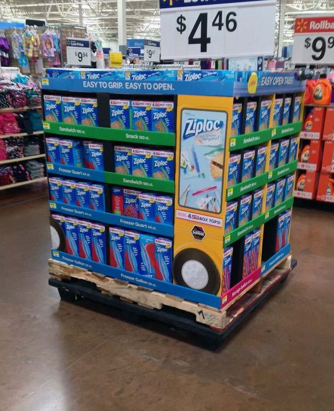 Cardboard Floor Display in Store A large, colorful floor display at the end of an aisle in Walmart.